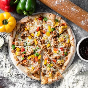 Pizza BBQ Chicken features juicy chicken, sweet BBQ sauce, and melted cheese on a crispy crust. BBQ Chicken Pizza in Abu Dhabi