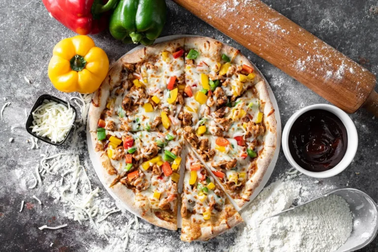 Pizza BBQ Chicken features juicy chicken, sweet BBQ sauce, and melted cheese on a crispy crust. BBQ Chicken Pizza in Abu Dhabi